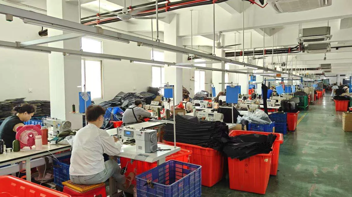 VegaTactical factory production line with skilled workers operating sewing machines for tactical gear manufacturing